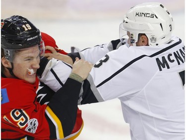 Calgary Flames Matthew Tkachuk fights Brayden McNabb of the Los Angeles Kings during NHL hockey in Calgary, Alta., on Wednesday, March 29, 2017.