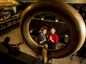 Restaurant owners Patcharin Smith (R) and Pornuma Worasuksri stand for a photo at Pad Thai, Thai Noodles and Cuisine, in Calgary, Alta., on Thursday, March 2, 2017. Shot for John Gilchrist's Off the Menu column. Lyle Aspinall/Postmedia Network