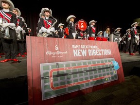 The Calgary Stampede Showband stands behind a sign during a press event at the Boyce Theatre in Calgary, Alta., on Tuesday, March 28, 2017. Officials announced this year's Stampede Parade on July 7 would run in a reverse direction than usual and that admission to Stampede Park would be free that day until 1:30 p.m. Lyle Aspinall/Postmedia Network