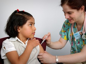 A girl receives an intramuscular vaccination from a nurse. Provided by: Judy Schmidt, CDC.
