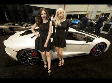 Shantal Zoto (L) and Tessa Greiner hang out with a Lamborghini Aventador S during the 18th annual Vehicles and Violins gala at the BMO Centre in Calgary, Alta., on Tuesday, March 14, 2017. Vehicles and Violins is a black-tie preview of the 2017 Calgary International Auto and Truck Show, featuring Calgary Philharmonic Orchestra musicians. Lyle Aspinall/Postmedia Network