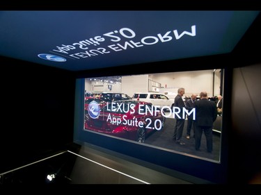 Men chat inside a Lexus display during the 18th annual Vehicles and Violins gala at the BMO Centre in Calgary, Alta., on Tuesday, March 14, 2017. Vehicles and Violins is a black-tie preview of the 2017 Calgary International Auto and Truck Show, featuring Calgary Philharmonic Orchestra musicians. Lyle Aspinall/Postmedia Network