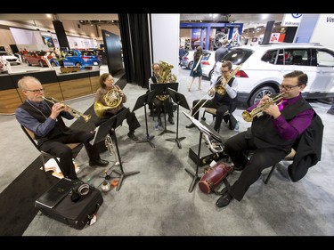 Members of the Calgary Philharmonic Orchestra play during the 18th annual Vehicles and Violins gala at the BMO Centre in Calgary, Alta., on Tuesday, March 14, 2017. Vehicles and Violins is a black-tie preview of the 2017 Calgary International Auto and Truck Show, featuring Calgary Philharmonic Orchestra musicians. Lyle Aspinall/Postmedia Network
