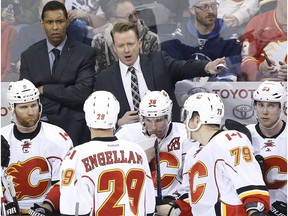 Calgary Flames head coach Glen Gulutzan talks to his team during third period NHL action against the Winnipeg Jets, in Winnipeg on Saturday, March 11, 2017.