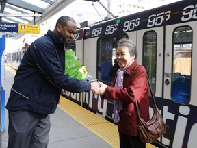 Li Feng Yang thanks CTrain operator Mesfin Tadese at the Centre street CTrain station in Calgary, Tuesday, March 28, 2017. Tadese found the 75-year-old Yang's purse containing $1,300 on a train and had it returned to her.