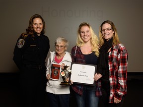 Honour recipient Andrea Lafont, 15, poses for a portrait with her mother Nicole Lafont, right, grandmother Judy Lafont and emergency communications officer Jennifer Bowman, left, in Calgary on Friday, April 7, 2017. Children and youth are honoured for having shown bravery during the dangerous or scary moment when they called 911. Pier Moreno Silvestri/Postmedia Network