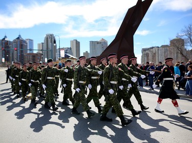 Members of the Calgary Garrison, comprised of Calgary-based Army Reserve soldiers from 41 Canadian Brigade Group (41 CBG), joined by a contingent of 100 soldiers from the British Army Training Unit Suffield march during a parade in Calgary, Alta., on Saturday April 8, 2017 to commemorate the Battle of Vimy.