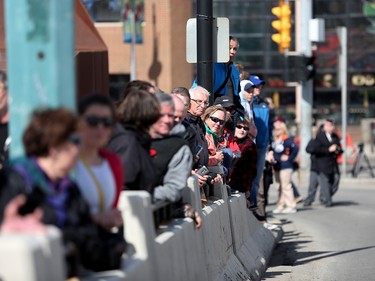 Calgarians watch as members of the 41 Canadian Brigade Group march during a parade in Calgary, Alta., on Saturday April 8, 2017 to commemorate the Battle of Vimy. Leah of Hennel/Postmedia
