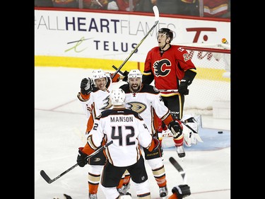 Anaheim Ducks Richard Rakell, left, and Nate Thompson react to their win against the Calgary Flames during NHL playoff action at the Scotiabank Saddledome in Calgary, Alta. on Monday April 17, 2017. Leah Hennel/Postmedia