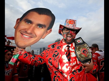 Calgary Flames fan Lincy Mathew cheers during the tailgate party outside the saddledome before the Flames take on the Anaheim Ducks in NHL playoff action at the Scotiabank Saddledome in Calgary, Alta. on Monday April 17, 2017. Leah Hennel/Postmedia