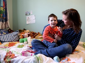 Michelle Downey and her son Adrian, pictured at their home in Calgary, Alta., on Sunday April 23, 2017,  faced serious medical complications after birth, and was saved by staff at Foothills NICU. Leah Hennel/Postmedia
