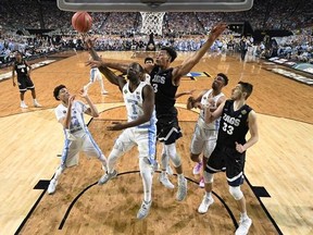 North Carolina&#039;s Theo Pinson (1) takes a shot against Gonzaga&#039;s Johnathan Williams (3) during the first half in the finals of the Final Four NCAA college basketball tournament, Monday, April 3, 2017, in Glendale, Ariz. (AP Photo/Chris Steppig, Pool)