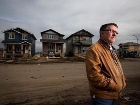 Gilles Huizinga president of the local Urban Development Institute and a homebuilder with Sedgewood Homes with newly built homes in the Timberlea area that was destroyed by wildfires last year in Fort McMurray, Alta. Thursday, April 20, 2017. THE CANADIAN PRESS/Todd Korol