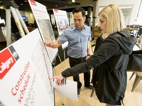 Ernie Tsu, owner of Trolley 5 Brewpub, walks through an info session with employee Mallory Moser on Wednesday. 17th Avenue is about to get a long-overdue makeover.