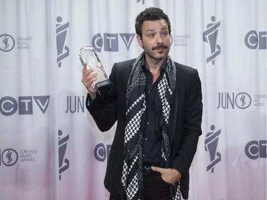 Adam Cohen poses with a Juno award on behalf of his father Leonard Cohen, for Album of the Year at the Juno awards show Sunday April 2, 2017 in Ottawa.