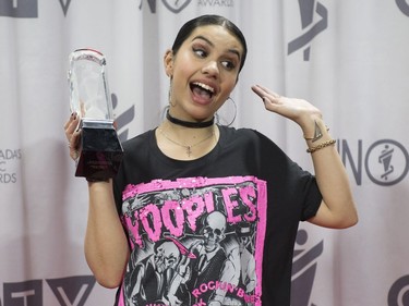 Alessia Cara jokes around as she holds a Juno award after winning for Pop Album of the Year at the Juno awards show Sunday April 2, 2017 in Ottawa.