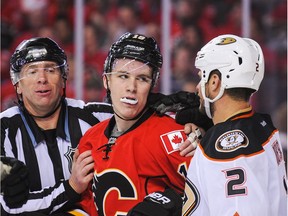 Matthew Tkachuk of the Calgary Flames, left, exchanges words with Kevin Bieksa #2 of the Anaheim Ducks after the whistle in Game Three of the Western Conference First Round during the 2017 NHL Stanley Cup Playoffs at Scotiabank Saddledome on April 17, 2017 in Calgary, Alberta, Canada.