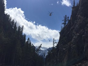 Canmore Fire-Rescue rescues an injured rock climber at Cougar Creek. Photo via Canmore Fire-Rescue Twitter.