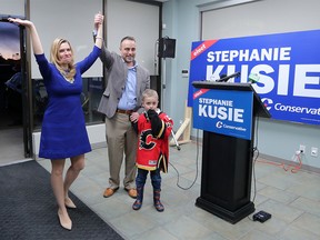 Conservative candidate Stephanie Kusie with her husband James and son Edward is welcomed by supporters after winning the federal riding of Calgary Midnapore on Monday April 3, 2017. Gavin Young/Postmedia Network