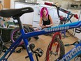 Steph Kat repairs used kid's bikes in her kitchen on Sunday April 16, 2017.  The Calgary woman fixes up the bikes for needy kids in time for spring and she has been overwhelmed with requests. Gavin Young/Postmedia Network