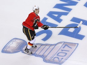 The Calgary Flames' Matthew Tkachuk skates over the Stanley Cup playoffs logo during practise at the Scotiabank Saddledome in Calgary on Monday April 10, 2017. The Flames begin their playoff run against the Ducks in Anaheim on Thursday.