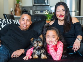 Rafael Alvarez and Sharon Castro-Alvarez, with their daughter Averie-Jade, 7, love sharing their new condo at Sandgate in Mahogany with Mr. T, a teacup Yorkshire Terrier.