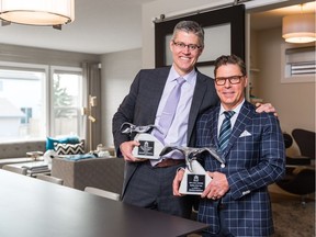 Brookfield Residential chief operating officer Trent Edwards and senior vice-president Allan Klassen with awards won at BILD Calgary Region's SAM Awards.