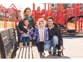 Jonas and Erin Lirantzis with their daughters Isabella (5) and Madelyn (3) and their dog Marlee in Fireside by La Vita Land.