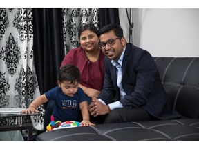 Sam Mathew and Blessy Cherian with their son Jayden in a new townhome by Mattamy Homes in Cityscape.