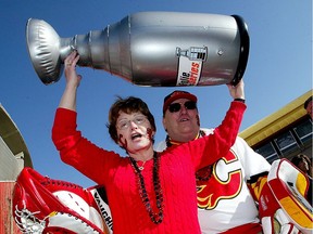 Ron and Barbara Erickson from Scottsbluff, Nebraska, show off their team spirit during the Calgary Flames tailgate party outside the Saddledome in 2006.