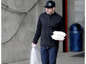 Calgary Flames goalie Brian Elliott leaves the Scotiabank Saddledome in Calgary, Alta. on Friday April 21, 2017.