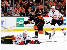 Jakob Silfverberg of the Anaheim Ducks shoots over a sliding Michael Stone of the Calgary Flames during a 3-2 Ducks win in Game 1 of their Western Conference playoff series at Honda Center on April 13, 2017 in Anaheim, Calif. (Harry How/Getty Images)