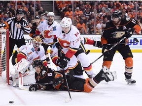 Rickard Rakell (67) of the Anaheim Ducks looks for a rebound against Calgary Flames goalie Brian Elliott and Mikael Backlund (11) during Game 1 of their Western Conference playoff series at Honda Center on April 13, 2017, in Anaheim, Calif. (Harry Howe/Getty Images)