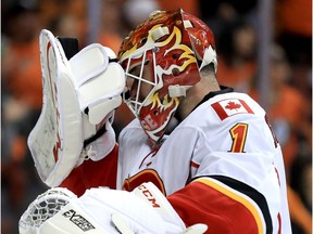 Brian Elliott #1 of the Calgary Flames holds his head after Ryan Getzlaf #15 of the Anaheim Ducks scored a goal during the third period of Game Two of the Western Conference First Round during the 2017 NHL Stanley Cup Playoffs at Honda Center on April 15, 2017 in Anaheim, California.