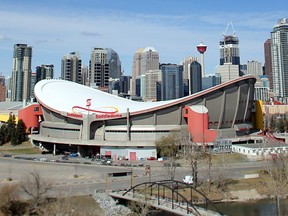 The Saddledome stands out against the Calgary skyline seen from Scotsman's Hill.
