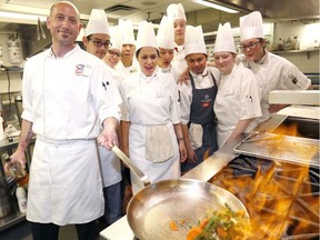 Chief Shawn Bourquin shows second year students how its done as SAIT announced The Tastemarket, a new culinary campus in downtown Calgary at 230 8th Ave. S.W.  on Tuesday April 25, 2017. DARREN MAKOWICHUK/Postmedia Network