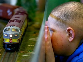 Xavier Lepage, 11 yrs, watches a model train pass on the tracks as he and his family take in Supertain 2017 at the Genesis Centre in Calgary, Alta on Sunday April 23, 2017. The show, dubbed as Canada's largest, attracted thousands of train/ rail afficiandos. Jim Wells//Postmedia