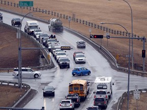 The intersection of 1A and Highway 22 (Cowboy Trail) will be getting a much needed expansion in Cochrane, Alta., as the twinning of the road was announced by the provincial government on April 7, 2017. Ryan McLeod/Postmedia Network