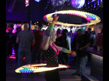 A hula hoop perfomer lights the way during day two of the Insane Clown Posse Juggalo Weekend held at the Marquee Beer Market in Calgary, Alta on Saturday April 8, 2017. The two day festival, the first in Canada is headlined by ICP, and includes a number of other heavy metal, gangsta rap, DJs, wrestlers, and circus performers. Jim Wells//Postmedia