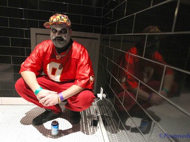 A Jugglo charges his phone in the men's room during day two of the Insane Clown Posse Juggalo Weekend held at the Marquee Beer Market in Calgary, Alta on Saturday April 8, 2017. The two day festival, the first in Canada is headlined by ICP, and includes a number of other heavy metal, gangsta rap, DJs, wrestlers, and circus performers. Jim Wells//Postmedia