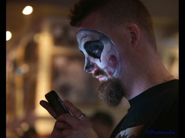A Juggalo looks at his phone during day two of the Insane Clown Posse Juggalo Weekend held at the Marquee Beer Market in Calgary, Alta on Saturday April 8, 2017. The two day festival, the first in Canada is headlined by ICP, and includes a number of other heavy metal, gangsta rap, DJs, wrestlers, and circus performers. Jim Wells//Postmedia