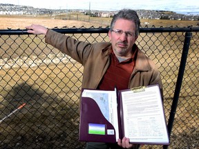 Tim Dixon, a resident in the community of Discovery Ridge in SW Calgary, Alta., on April 14, 2017. Dixon is petitioning the government to come up with a barrier between the community he lives in and the SW Ring Road. Ryan McLeod/Postmedia Network