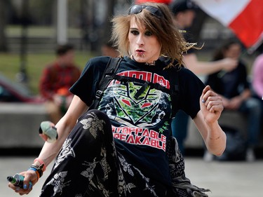 Kaeli Khaos joins friends in a game of Hacky Sack while smoking some cannabis products during  the 4/20 (April 20) celebration of cannabis culture in Calgary. 
Ryan McLeod/Postmedia Network