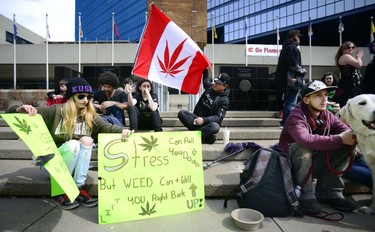 Signs and smoke filled the grounds outside of City Hall. Calgary pot advocates and users alike joined in the 4/20 (April 20) celebration of cannabis culture on April 20, 2017 at City Hall. Ryan McLeod/Postmedia Network