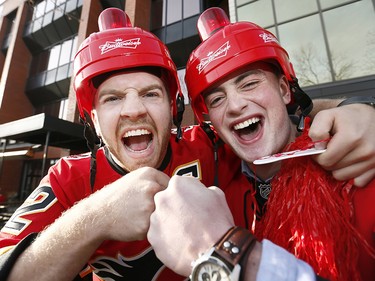 Calgary Flames fans L-R, Brett Wakeman and J.R. Garik cheer on their team during Game 4 against the Ducks along the Red Mile on Wednesday April 19, 2017. DARREN MAKOWICHUK/Postmedia Network