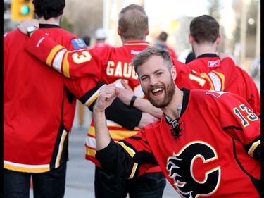 Calgary Flames fan Taylor Perkins and friends make some noise as they head to the Scotiabank Saddledome for Game 4 against the Ducks along the Red Mile on Wednesday April 19, 2017. DARREN MAKOWICHUK/Postmedia Network