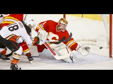 Patrick Eaves of the Anaheim Ducks scores on Calgary Flames goalie Brian Elliott during NHL action in Calgary, Alta., on Sunday, April 2, 2017. Lyle Aspinall/Postmedia Network