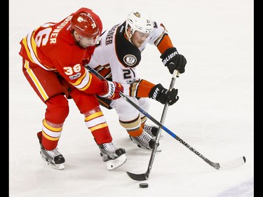 Chris Wagner of the Anaheim Ducks skates against Troy Brouwer of the Calgary Flames during NHL action in Calgary, Alta., on Sunday, April 2, 2017. Lyle Aspinall/Postmedia Network