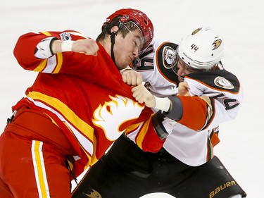 Micheal Ferland of the Calgary Flames fights Nate Thompson of the Anaheim Ducks during NHL action in Calgary, Alta., on Sunday, April 2, 2017. Lyle Aspinall/Postmedia Network