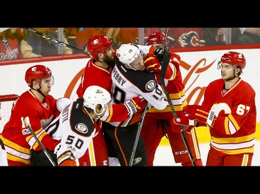 Mikael Backlund, Deryk Engelland, Matt Bartkowski and Michael Frolik of the Calgary Flames tussle with Antoine Vermette and Corey Perry of the Anaheim Ducks during NHL action in Calgary, Alta., on Sunday, April 2, 2017. Lyle Aspinall/Postmedia Network